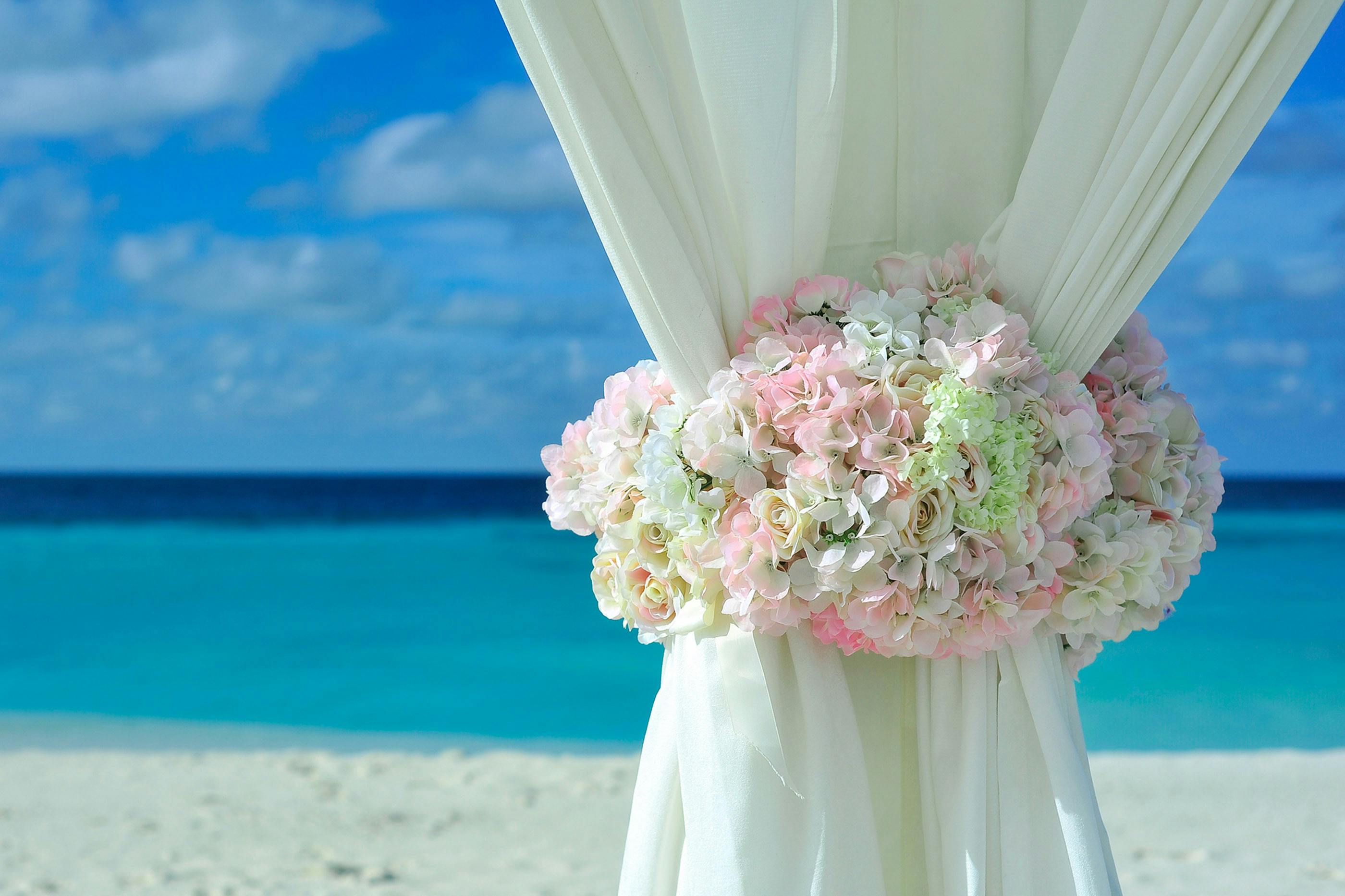 Elegant wedding ceremony setup with ocean view